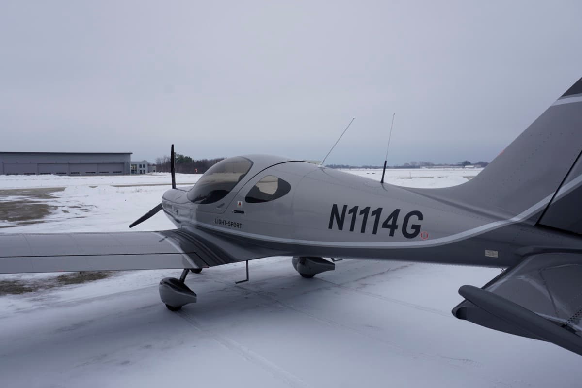 Bristell N1114G parked on a snow-lined ramp